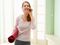 Woman with yoga mat and cell phone