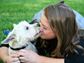 Woman snorgling her pet puppy