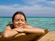 Woman smiling on the beach