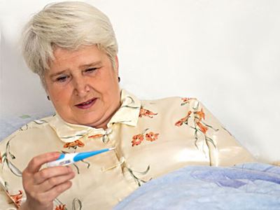 Woman checking her temperature