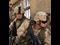 U.S. Army soldiers along wall