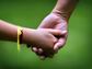 Mother holding a child's hand