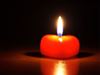 Heart-shaped red candle