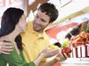 Man and woman shopping for vegetables