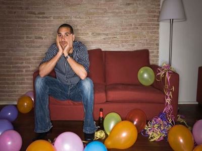 Sad man at birthday party