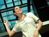 Woman throwing paper airplane
