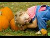 little girl with pumpkin