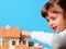 little girl building home