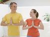 Man and woman doing yoga