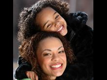mother daughter together smiling