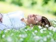 Woman lying in a field of flowers