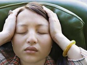 Stressed young Asian woman
