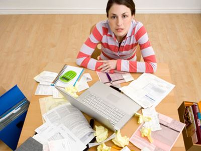 Woman at Cluttered Desk
