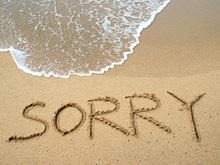Sorry written on sand on beach