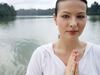 Relaxed woman by a lake