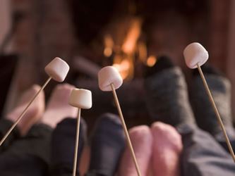 Roasting marshmallows by the fireplace