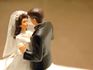 Bride and groom wedding cake topper