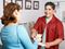 Man and woman exchange money