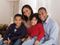 Family posed, sitting down