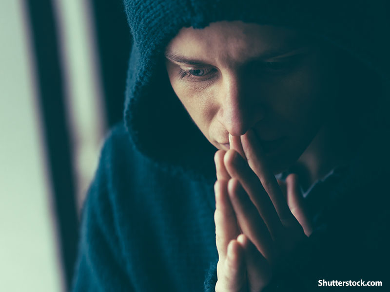 man sad praying