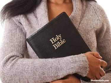 people holding bible