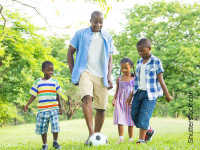 Dad Playing Soccer With Kids