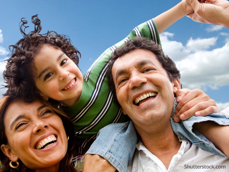 latino-family-parents-child-sky