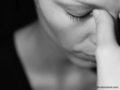 woman depressed headache sad
